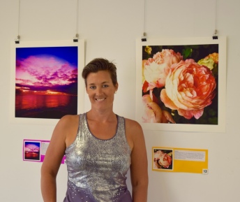 This is me standing in front of two of my images. One was the sunset at my Mums ashes ceremony, the other beautiful roses that crossed my path and reminded how amazing nature is.